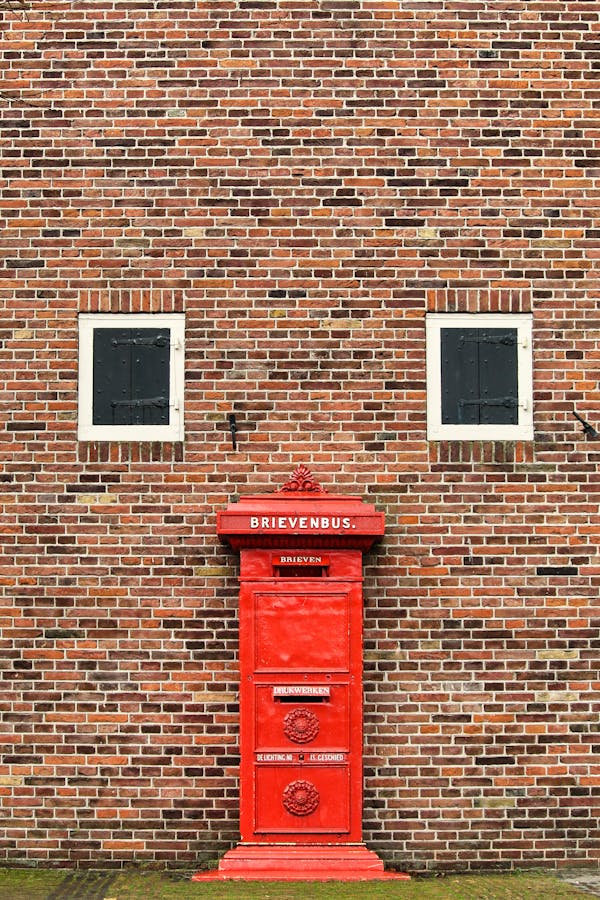 Asymmetric red mailbox.